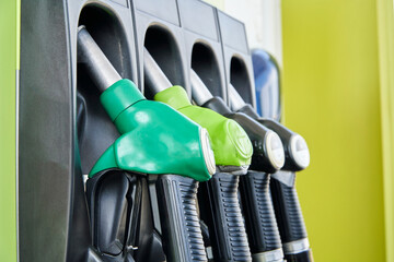 gasoline pump nozzles on petrol station