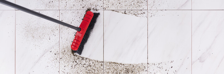 Broom Cleaning Dirt On Tiled Floor