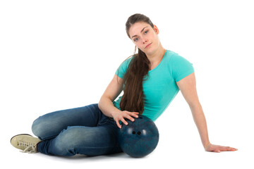 Beautiful woman sitting with a bowling ball, isolated on white