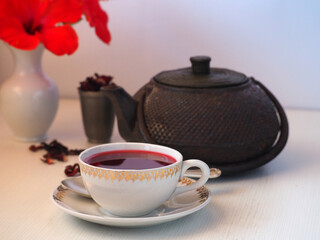 Hot fresh sweet berry tea in a white cup