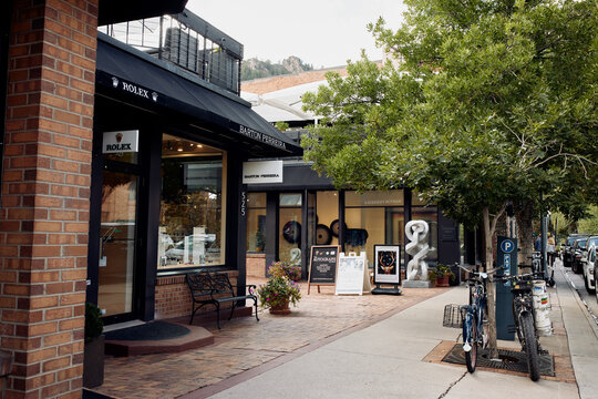 Aspen, Colorado - September 16th, 2022: Art galleries and clothing boutiques featuring various sculptures in Downtown Aspen.  