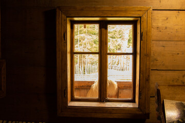 Fototapeta na wymiar Wooden old house with windows in Ukraine, the window