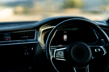 black car steering wheel close-up