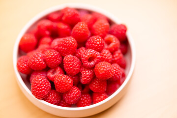 Raspberry fruit on the bowl