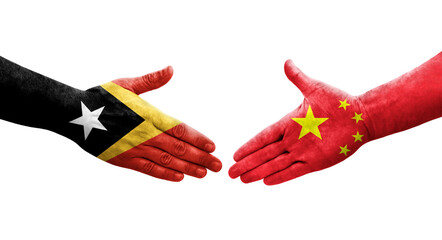 Handshake between China and Timor Leste flags painted on hands, isolated transparent image.