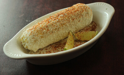 Grilled Corn with Mayo, fresh cheese, and chilli powder.
