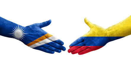 Handshake between Colombia and Marshall Islands flags painted on hands, isolated transparent image.