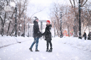 Young couple walking through the winter