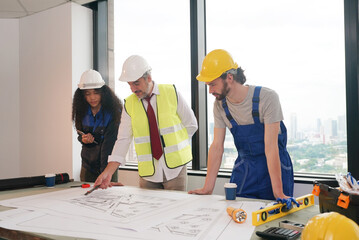 Architect and construction engineer or surveyor discussion plans and blueprints