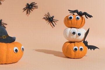 Decoration for Halloween party - cute pumpkin heads with eyes and funny faces. Set pumpkin monsters...