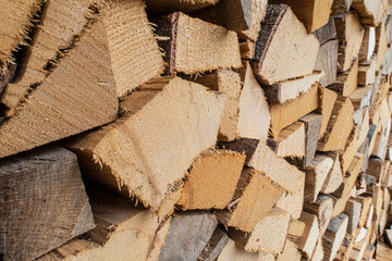  screen-filling close-up of logs of firewood