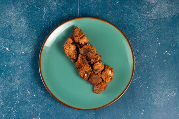 spicy bbq chicken tikka boti kabab served in a dish isolated on background top view