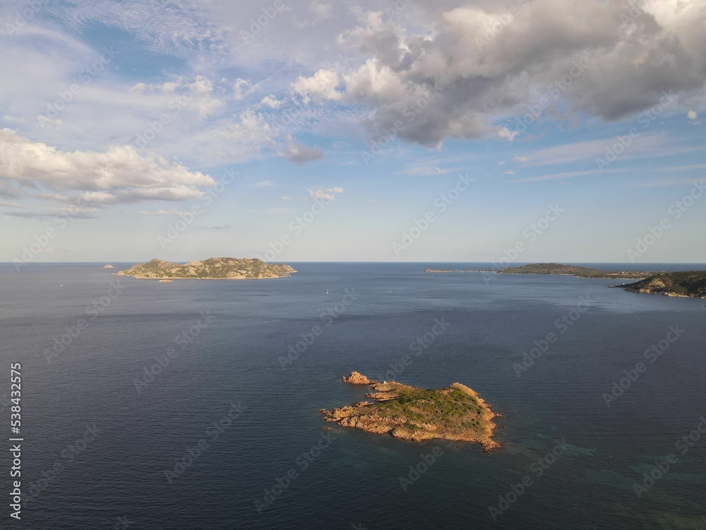 Poster aerial view of tavolara island, lagoon, porto taverna beach in sardinia, italy on clear sunny day.