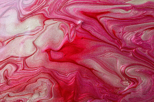 Elegant marble gold and red background,make from liquid nail polishes.Good as cosmetics backdrop.