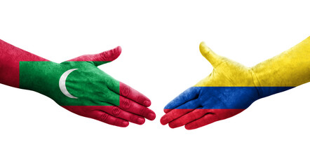 Handshake between Colombia and Maldives flags painted on hands, isolated transparent image.