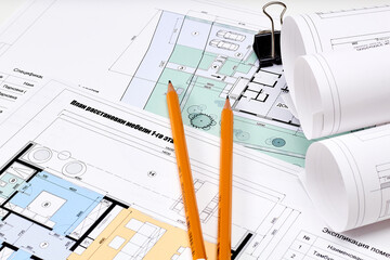 Naklejka na ściany i meble Working tools and drawings of the designer on a white background. Construction of houses, drawing, interior design.
