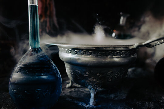 A Smoking Cauldron And A Blue Magic Potion