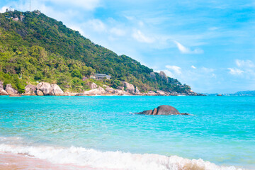 Tropical seascape. Blue sea and mountains on a sunny day on a tropical island in Thailand. Travel and tourism