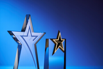 close up of glass or crystal trophy against blue background