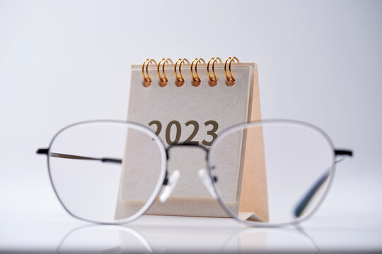 close up of  2023 desk calendar and eyeglasses