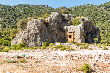 Rock formation with carved Lycian rock tombs near Demre city of Antalya province of Turkey.