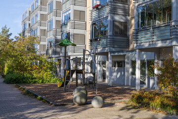 Residential building with playground. Real estate investment. Expensive housing.
