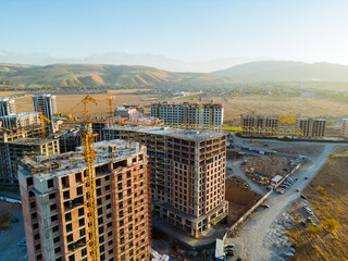 Fototapeta premium Aerial view of construction site of buildings