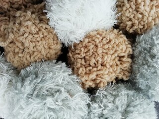 white, grey, beige pom poms background