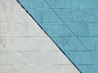 Colorful painted tile wall (blue, white and black) as background or texture