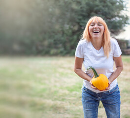 thanksgiving. Thanksgiving Day. Thanksgiving autumn background from pumpkins. Girl in white t-shirt...