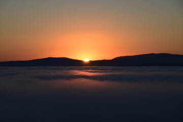 sunset over the clouds