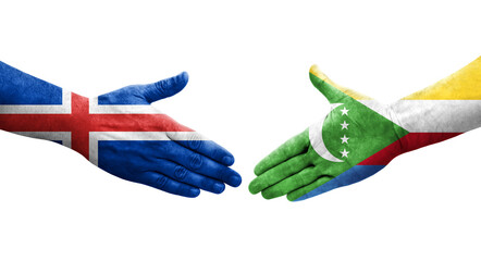 Handshake between Comoros and Iceland flags painted on hands, isolated transparent image.