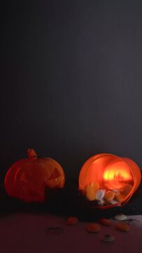 Halloween Background With Pumpkin And Pail With Candies Multicolored Lights