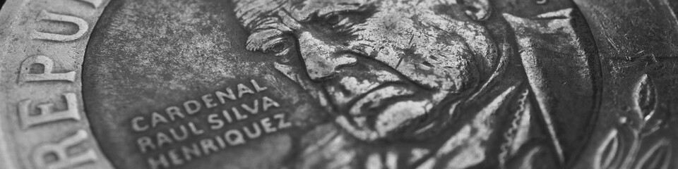 Coin of 500 Chilean pesos close-up. Peso of Chile. News about economy or banking. Loan and credit. Wages and money. Black and white banner or header. Macro