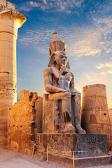 Statue of Ramesses seated by the Luxor Temple entrance, Egypt - obrazy, fototapety, plakaty