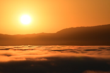 sunset over the clouds