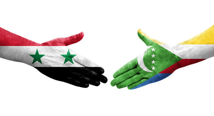 Handshake between Comoros and Syria flags painted on hands, isolated transparent image.