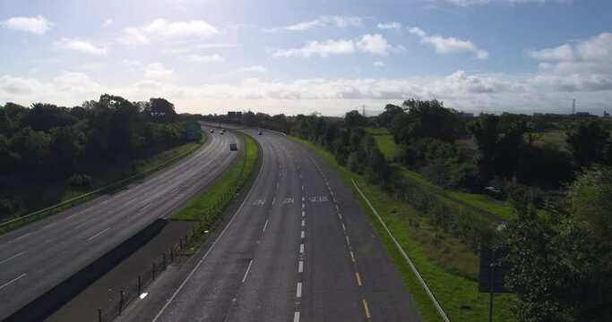  Motorway road traffic viewed from bridge overpass Ireland green landscape
