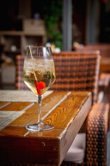 Summer alcoholic cocktail. Aperol lillet spritz with cherry, a beach refreshing cocktail at the bar