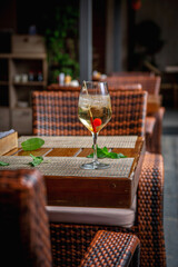 Summer alcoholic cocktail. Aperol lillet spritz with cherry, a beach refreshing cocktail at the bar