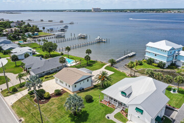 Aerial looking southwest over the Intracoastal Waterway ( Halifax River) and Daytona Beach Shores wealthy riverfront houses and boat docks. 