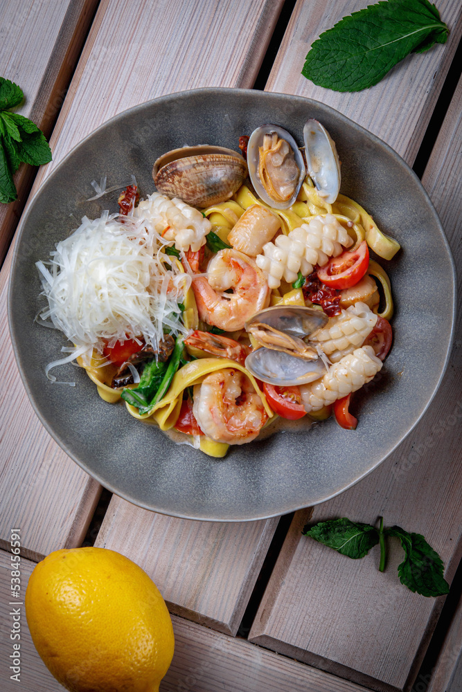 Poster Pasta with fresh seafood, shrimp, red pepper, oysters, scallops, squid and tomato - Posters