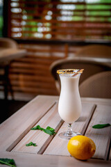 Alcohol-free, refreshing vanilla shake cocktail on the restaurant's summer terrace. Vanilla Ice Cream Milk Shake. Banana Smoothie with Mint and Vanilla.