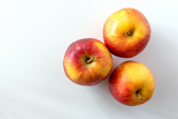 Fresh red apples on a white background. Top view