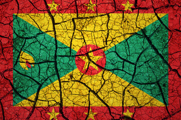 Dry soil pattern on the flag of Grenada. Country with drought concept. Water problem. Dry cracked earth country.	