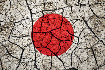 Dry soil pattern on the flag of Japan. Country with drought concept. Water problem. Dry cracked earth country.	