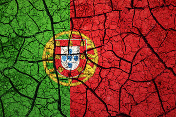 Dry soil pattern on the flag of Portugal. Country with drought concept. Water problem. Dry cracked earth country.	