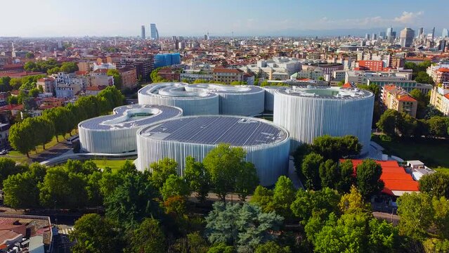 Aerial view of solar panels on the roof. The new campus of the SDA Bocconi School of Management is a modern building with classrooms. Autumn trees. Ecological energy. Milan Italy 11.2022