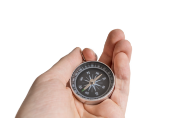 Man is holding compass in hand for navigation.