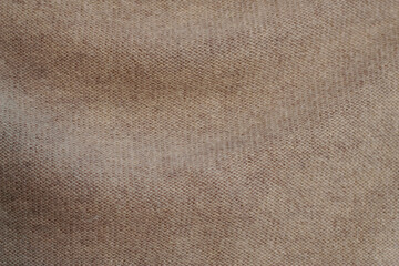 close up of beige cashmere warm clothes as a textured background

